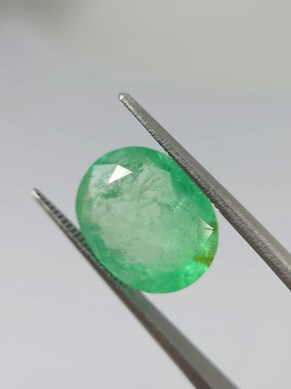 7.7ct Oval Faceted Minor Oiled Panjshir Emerald from Afghanistan